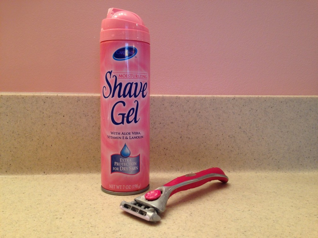 woman's razor and shave gel