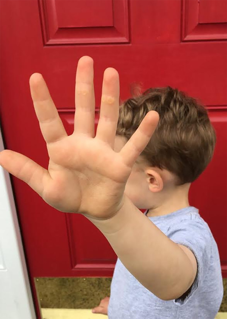 child's palm pushing away
