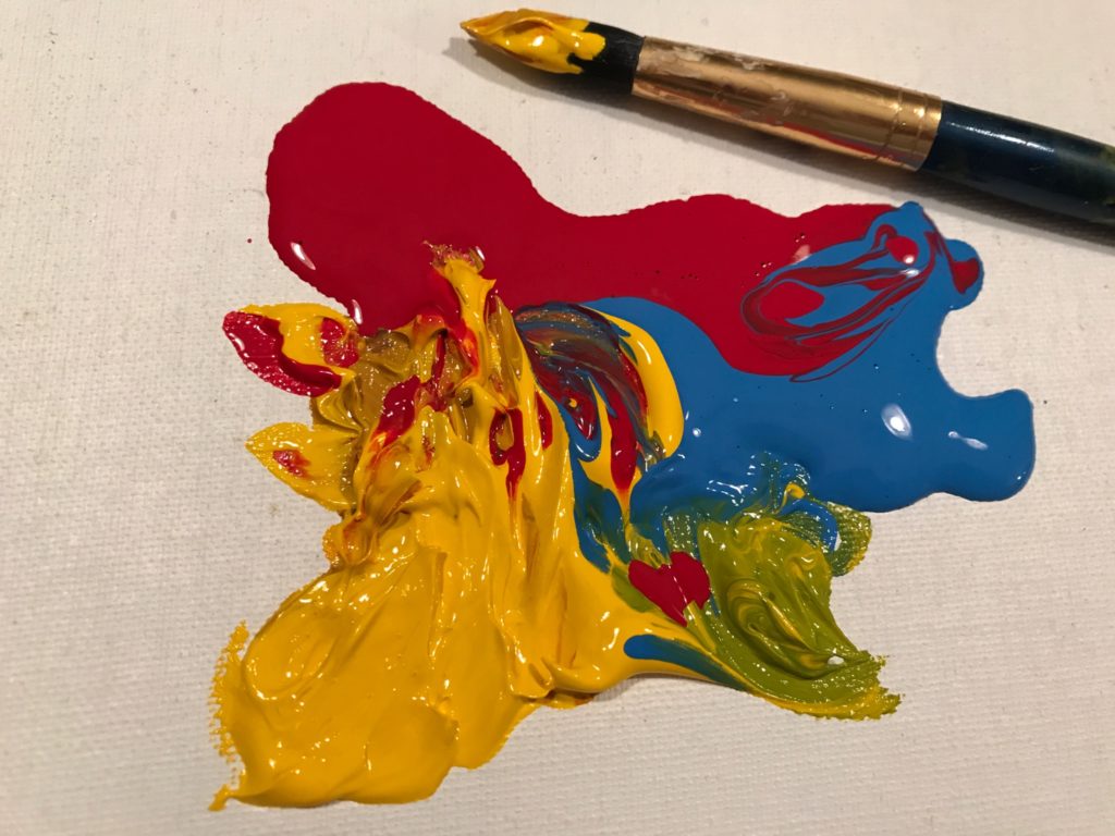 red, yellow and blue paint, swirled