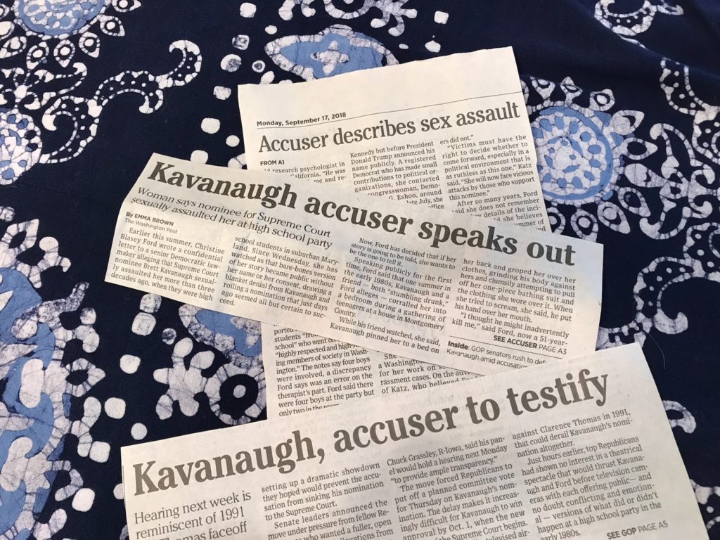 newspaper clippings about accusations against Kavanaugh