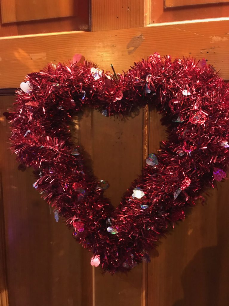 red, shimmery heart-shaped wreath