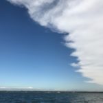 clouds giving way to blue sky