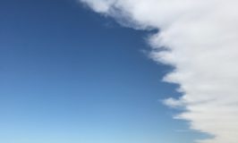 clouds giving way to blue sky