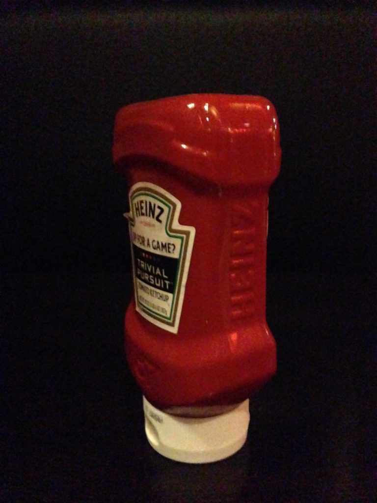ketchup bottle, black background