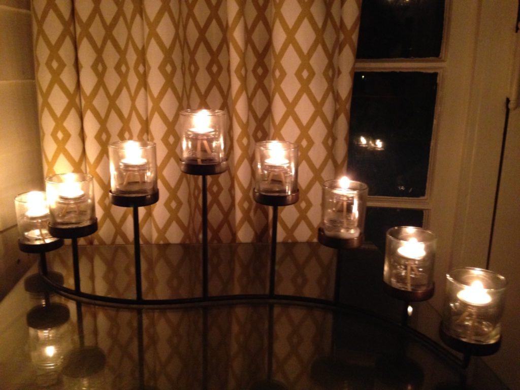 modern candle stand w lit candles