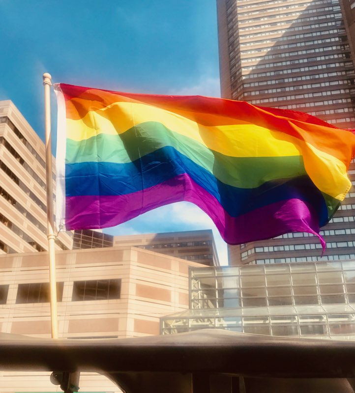 rainbow flag in urban setting